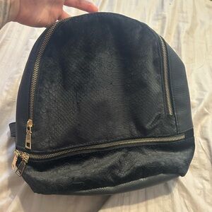 Black Textured Backpack with Gold Zippers